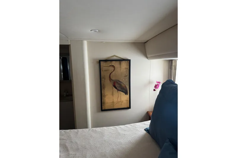 Ananda Yacht Photos Pics Interior of 1999 Silverton 422 Motor Yacht with elegant bird artwork and floral decor.