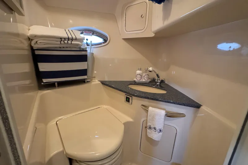  Yacht Photos Pics 2003 Sea Ray 420 Sundancer bathroom with sink, toilet, and storage.