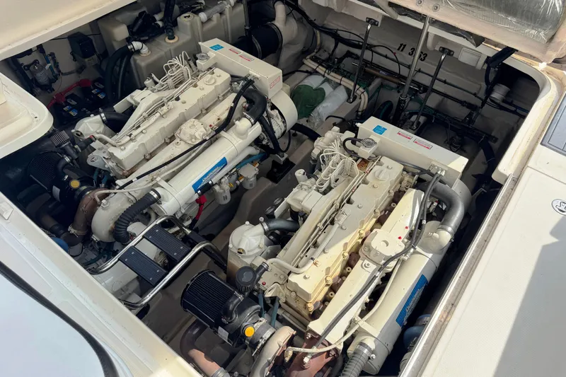  Yacht Photos Pics Engine compartment of a 2003 Sea Ray 420 Sundancer boat, showcasing dual engines.