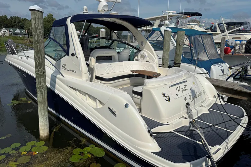  Yacht Photos Pics 2003 Sea Ray 420 Sundancer yacht docked at marina, featuring sleek design and spacious deck.
