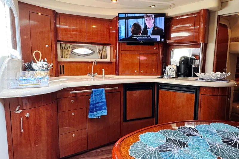  Yacht Photos Pics Luxurious 2003 Sea Ray 420 Sundancer yacht interior with elegant wood cabinetry and modern amenities.