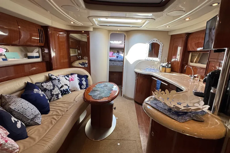  Yacht Photos Pics Luxurious interior of a 2003 Sea Ray 420 Sundancer yacht with elegant furnishings.