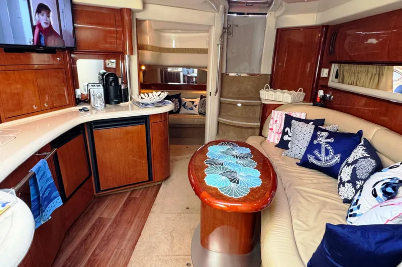  Yacht Photos Pics Luxurious interior of 2003 Sea Ray 420 Sundancer yacht with elegant seating and decor.