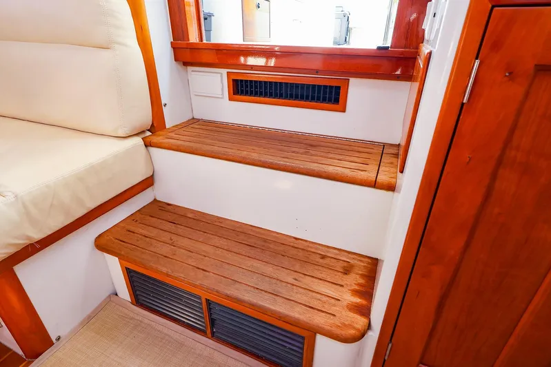 4815tw Yacht Photos Pics Interior of 2010 MJM 40z Downeast boat with wooden steps and seating.