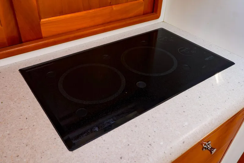 4815tw Yacht Photos Pics Glass cooktop on MJM 40z Downeast 2010 yacht, set in a sleek countertop.