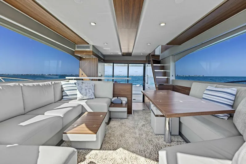 Barbara Sue III Yacht Photos Pics Luxurious interior of 2025 Maritimo M55 yacht with elegant seating and ocean view.