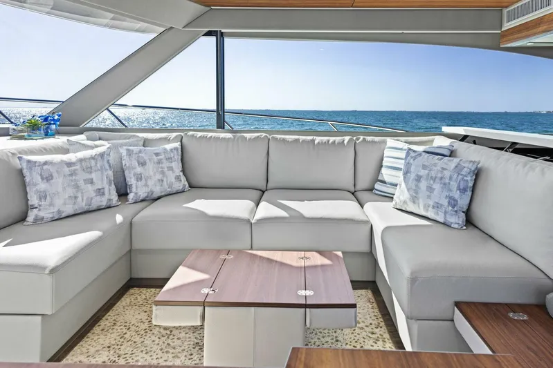 Barbara Sue III Yacht Photos Pics Luxurious interior of 2025 Maritimo M55 yacht with plush seating and ocean view.