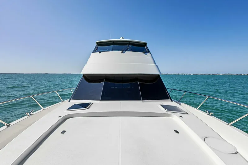 Barbara Sue III Yacht Photos Pics 2025 Maritimo M55 yacht on open sea under clear blue sky.