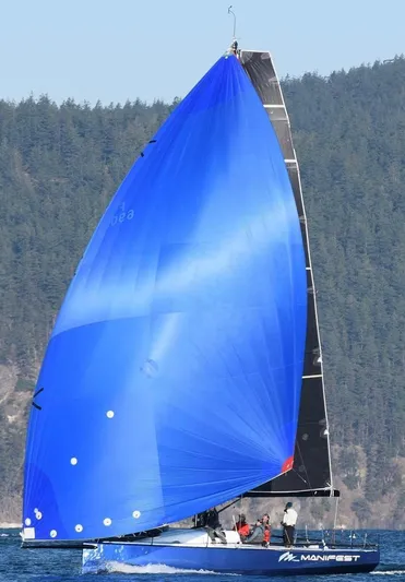 Manifest Yacht Photos Pics 2016 Offshore Racing Van Munster Boats Fred Barrett 35 with a vibrant blue sail on open water.
