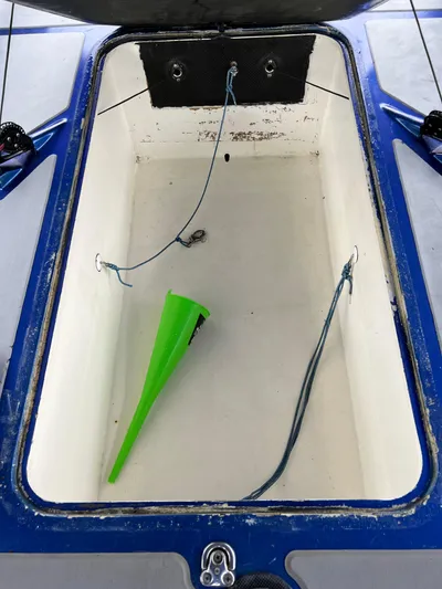 Manifest Yacht Photos Pics Open storage compartment of 2016 Offshore Racing Van Munster Boats Fred Barrett 35 with green funnel.