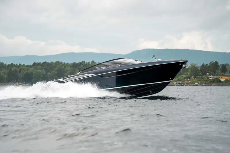  Yacht Photos Pics 2021 Riva Rivamare 38 luxury yacht cruising on a scenic lake.