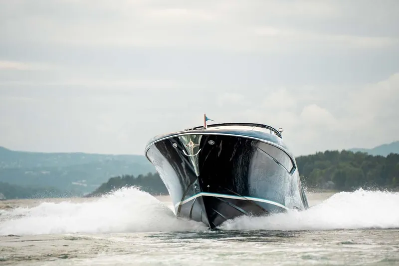  Yacht Photos Pics 2021 Riva Rivamare 38 cruising on water, front view with waves.