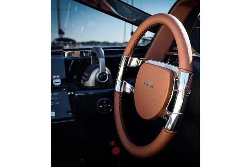  Yacht Photos Pics Luxurious 2021 Riva Rivamare 38 yacht steering wheel, featuring elegant leather and chrome accents.