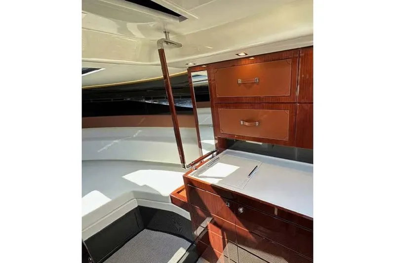  Yacht Photos Pics Luxurious interior of 2021 Riva Rivamare 38 yacht with elegant wood cabinetry.