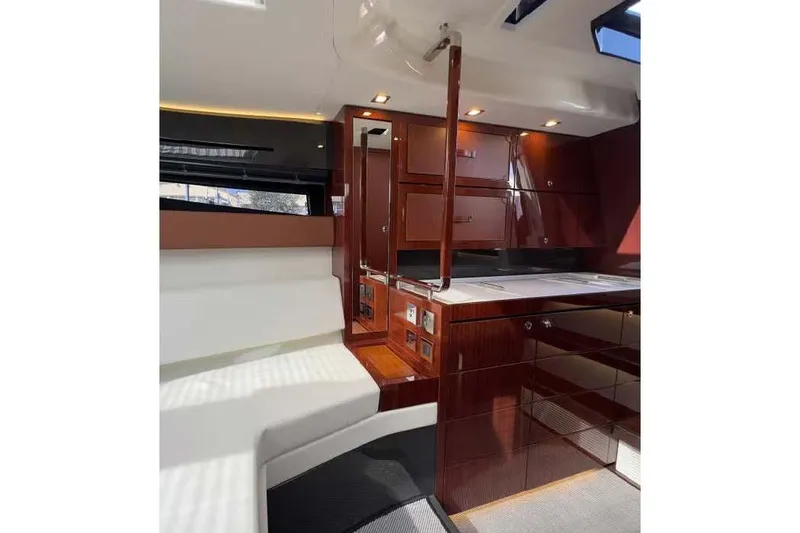  Yacht Photos Pics Luxurious interior of 2021 Riva Rivamare 38 yacht with elegant wood finishes.