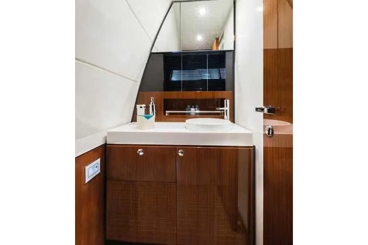  Yacht Photos Pics Luxurious bathroom interior of 2021 Riva Rivamare 38 yacht with modern fixtures.