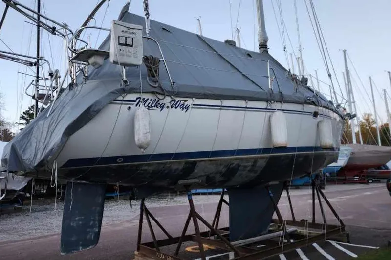 Milky Way Yacht Photos Pics 2004 Catalina 350 sailboat named "Milkey Way" on a stand, covered and docked.