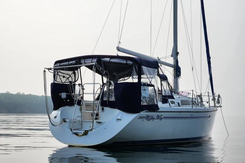 Milky Way Yacht Photos Pics Catalina 350 sailboat from 2004 on calm water, featuring a sleek design and canopy.