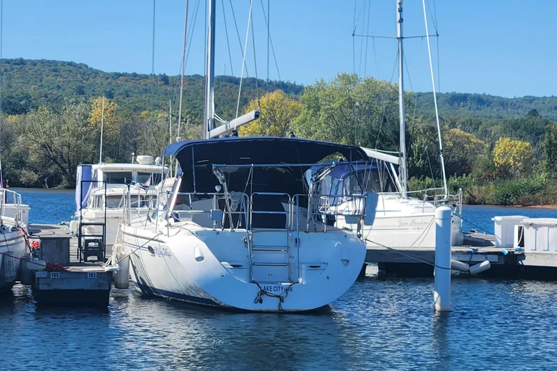 Milky Way Yacht Photos Pics Catalina 350 sailboat docked at marina, surrounded by scenic greenery, 2004 model.
