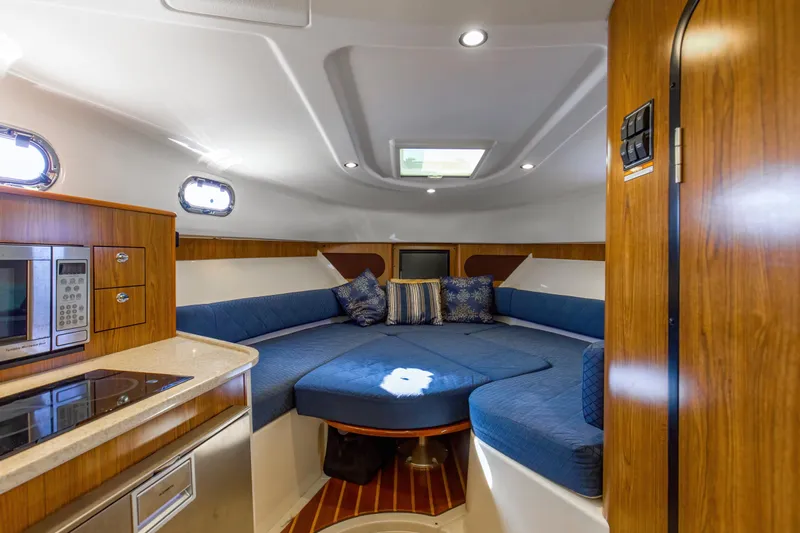 Still Noodling Yacht Photos Pics 2012 Pursuit 345 Offshore Convertible V-berth-Electrically Actuated Tabletop lowers to form base for filler cushion