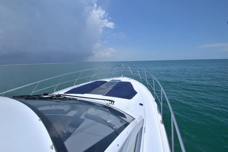 Stepping Stone V Yacht Photos Pics 2018 Cruisers Yachts 54 Fly on open sea under clear blue sky.