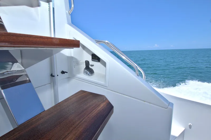 Stepping Stone V Yacht Photos Pics Staircase on 2018 Cruisers Yachts 54 Fly with ocean view.