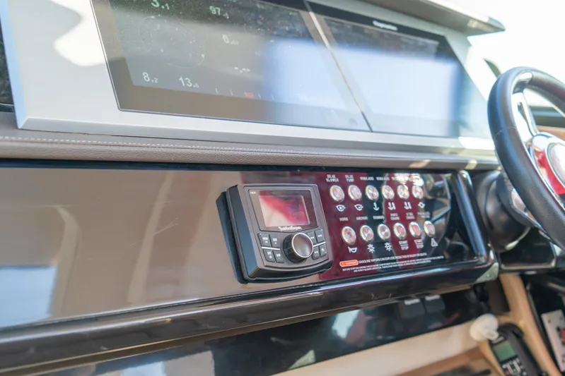  Yacht Photos Pics Control panel of 2018 Sea Ray SLX 400 boat with navigation screens and controls.