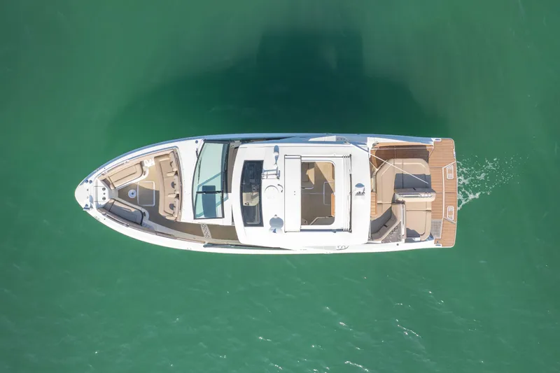 Yacht Photos Pics Aerial view of 2018 Sea Ray SLX 400 luxury boat cruising on clear water.
