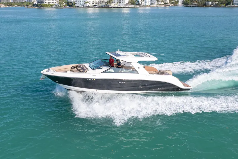  Yacht Photos Pics 2018 Sea Ray SLX 400 cruising on clear blue water.