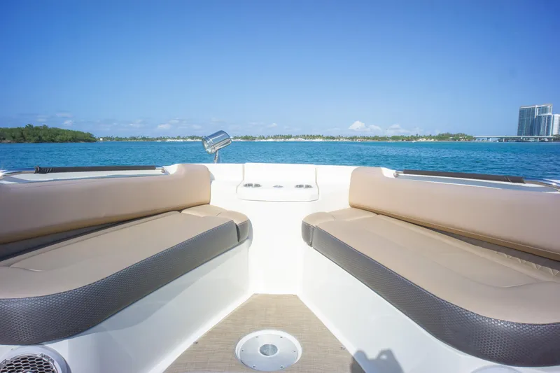  Yacht Photos Pics 2018 Sea Ray SLX 400 boat interior with tan seating, ocean view, and clear blue sky.