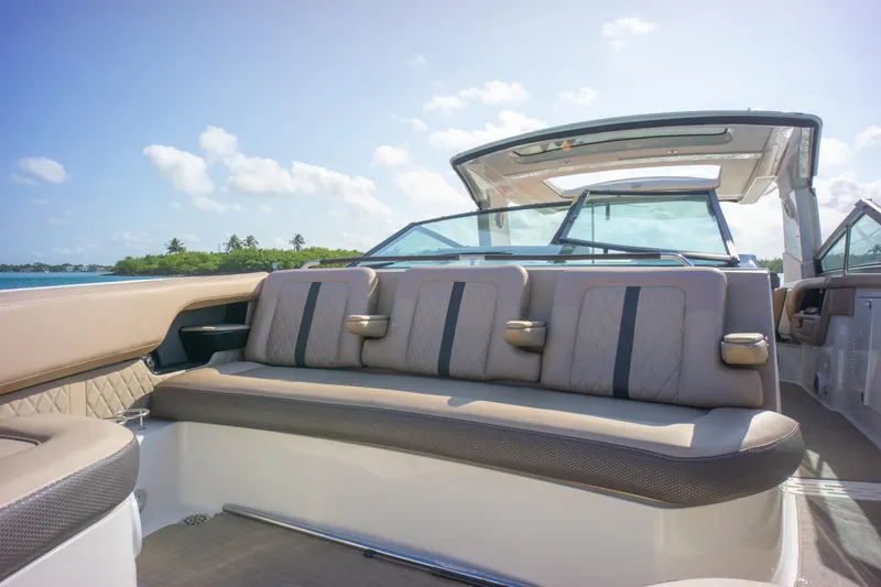  Yacht Photos Pics Luxurious 2018 Sea Ray SLX 400 boat interior with plush seating and scenic ocean view.