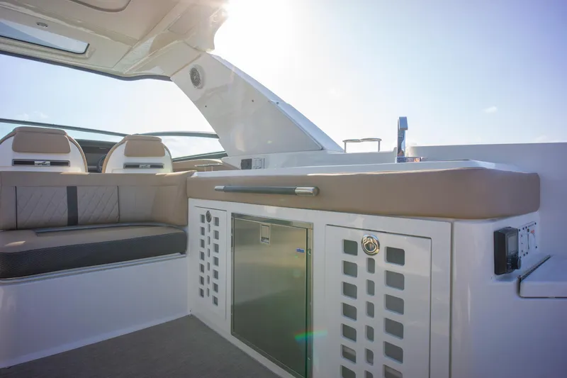  Yacht Photos Pics Luxurious interior of 2018 Sea Ray SLX 400 boat with seating and storage.