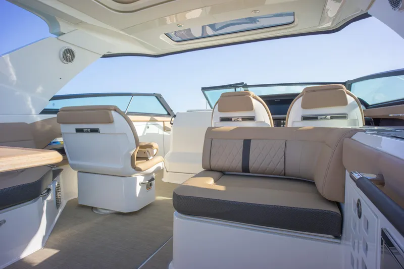  Yacht Photos Pics Luxurious interior of 2018 Sea Ray SLX 400 boat with plush seating and modern design.