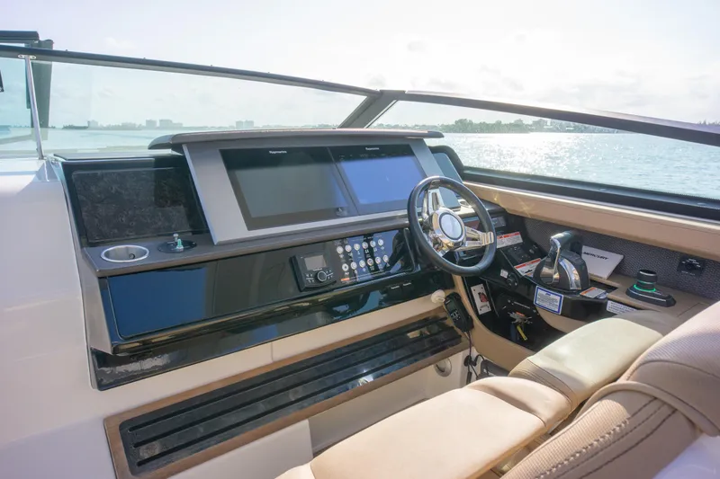  Yacht Photos Pics 2018 Sea Ray SLX 400 helm with modern controls and scenic water view.