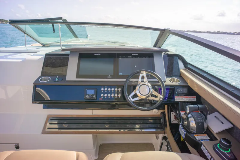  Yacht Photos Pics Helm of 2018 Sea Ray SLX 400 yacht with modern controls and steering wheel.