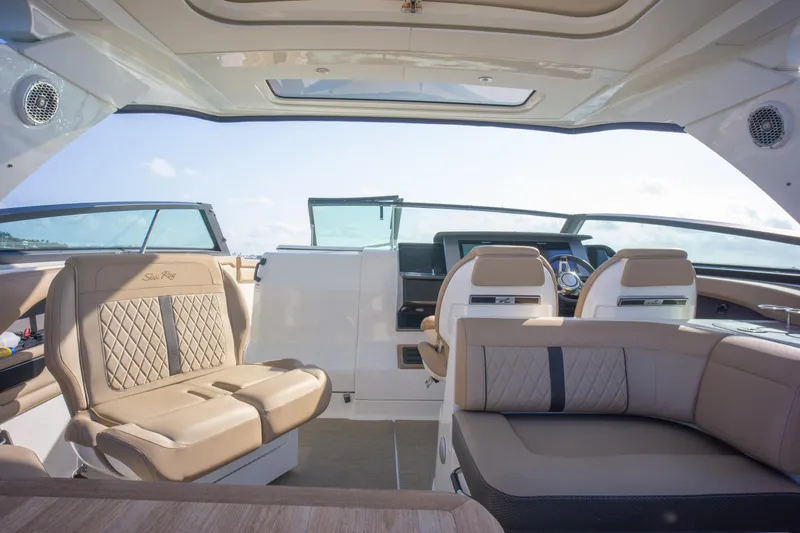  Yacht Photos Pics Luxurious interior of 2018 Sea Ray SLX 400 boat with elegant seating and modern design.