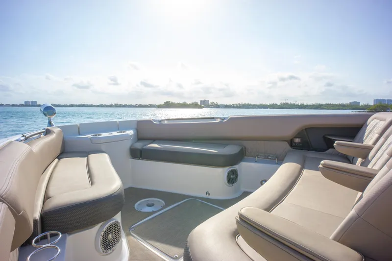  Yacht Photos Pics 2018 Sea Ray SLX 400 boat interior with luxurious seating, overlooking serene water and clear sky.