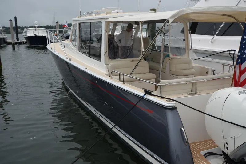 Whim Yacht Photos Pics 2020 MJM 43z luxury yacht docked at marina, featuring sleek design and spacious seating.