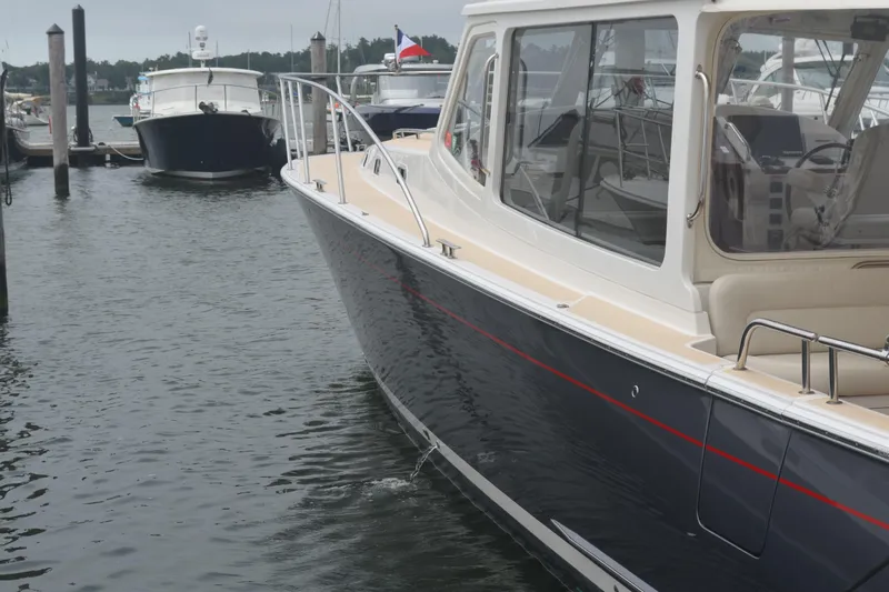 Whim Yacht Photos Pics 2020 MJM 43z yacht docked in marina, sleek design, calm waters.