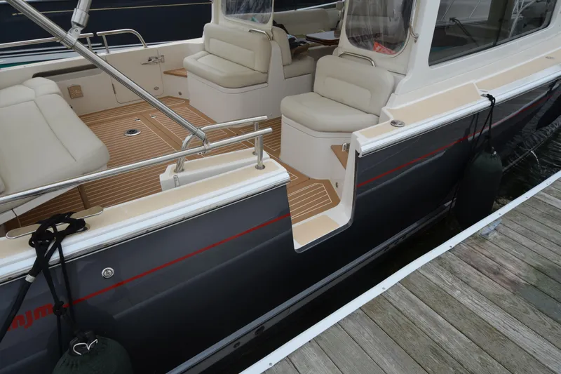 Whim Yacht Photos Pics 2020 MJM 43z boat interior with cushioned seating and teak flooring.