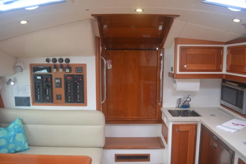 Whim Yacht Photos Pics Interior of 2020 MJM 43z yacht featuring kitchen and control panel.
