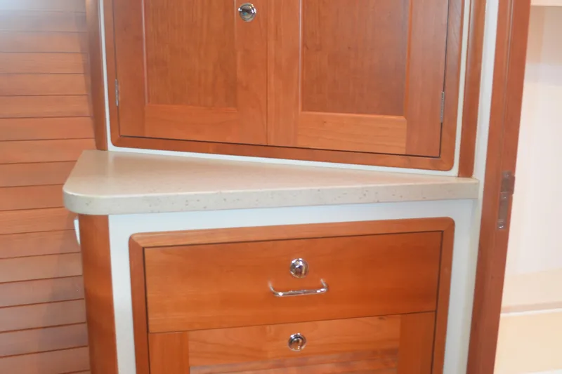 Whim Yacht Photos Pics Wooden cabinetry inside 2020 MJM 43z boat, featuring sleek design and polished finish.