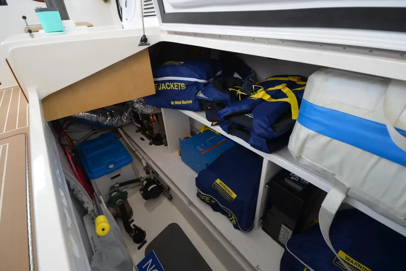 Whim Yacht Photos Pics Storage compartment of 2020 MJM 43z boat with life jackets and equipment.