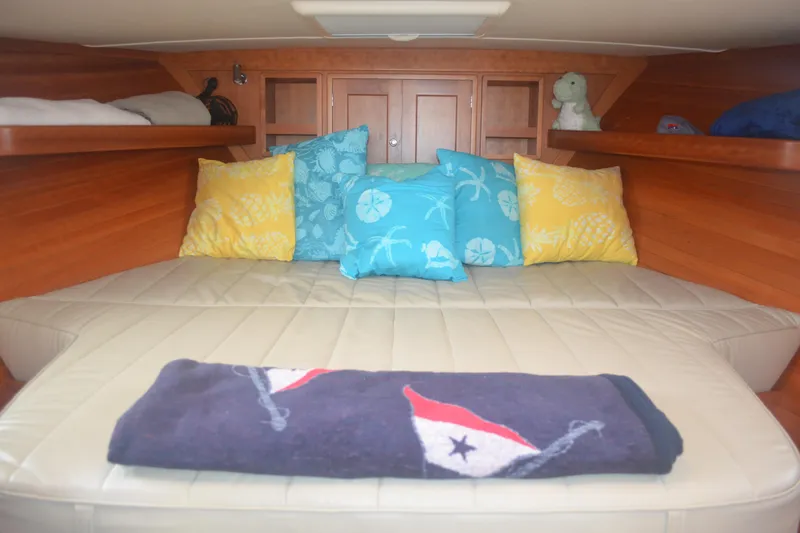 Whim Yacht Photos Pics Cozy cabin interior of 2020 MJM 43z with colorful pillows and plush bedding.