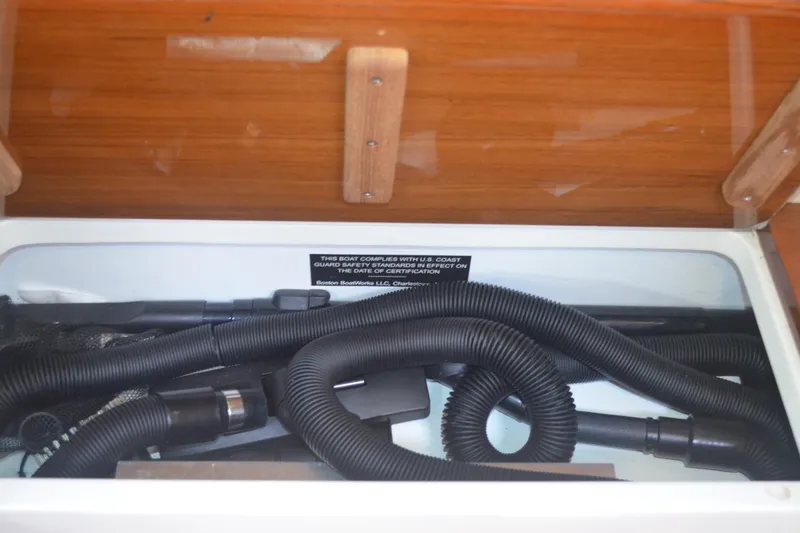 Whim Yacht Photos Pics Storage compartment with hoses in 2020 MJM 43z boat interior.