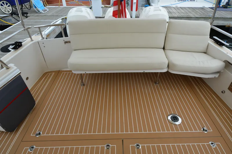 Whim Yacht Photos Pics Luxury seating on 2020 MJM 43z boat deck with teak flooring.