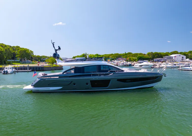Second Chances Yacht Photos Pics 2024 Azimut S7 yacht cruising in a scenic marina under a clear blue sky.