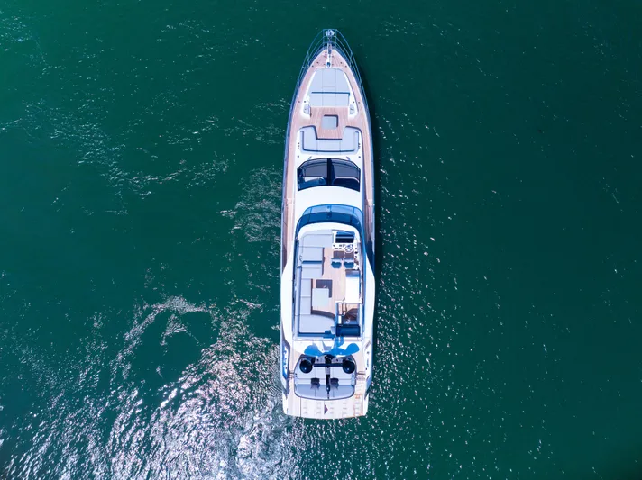 Second Chances Yacht Photos Pics Aerial view of 2024 Azimut S7 yacht cruising on clear blue water.
