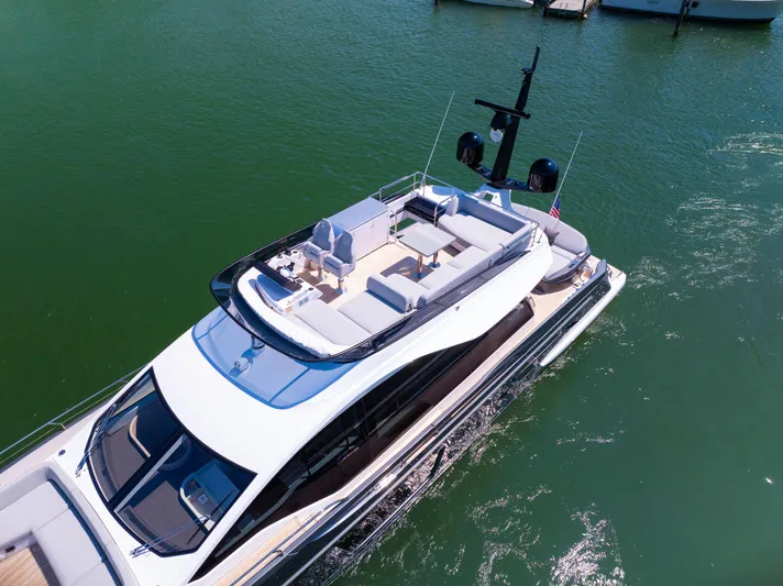 Second Chances Yacht Photos Pics 2024 Azimut S7 yacht cruising on clear green water, showcasing sleek design and luxury features.