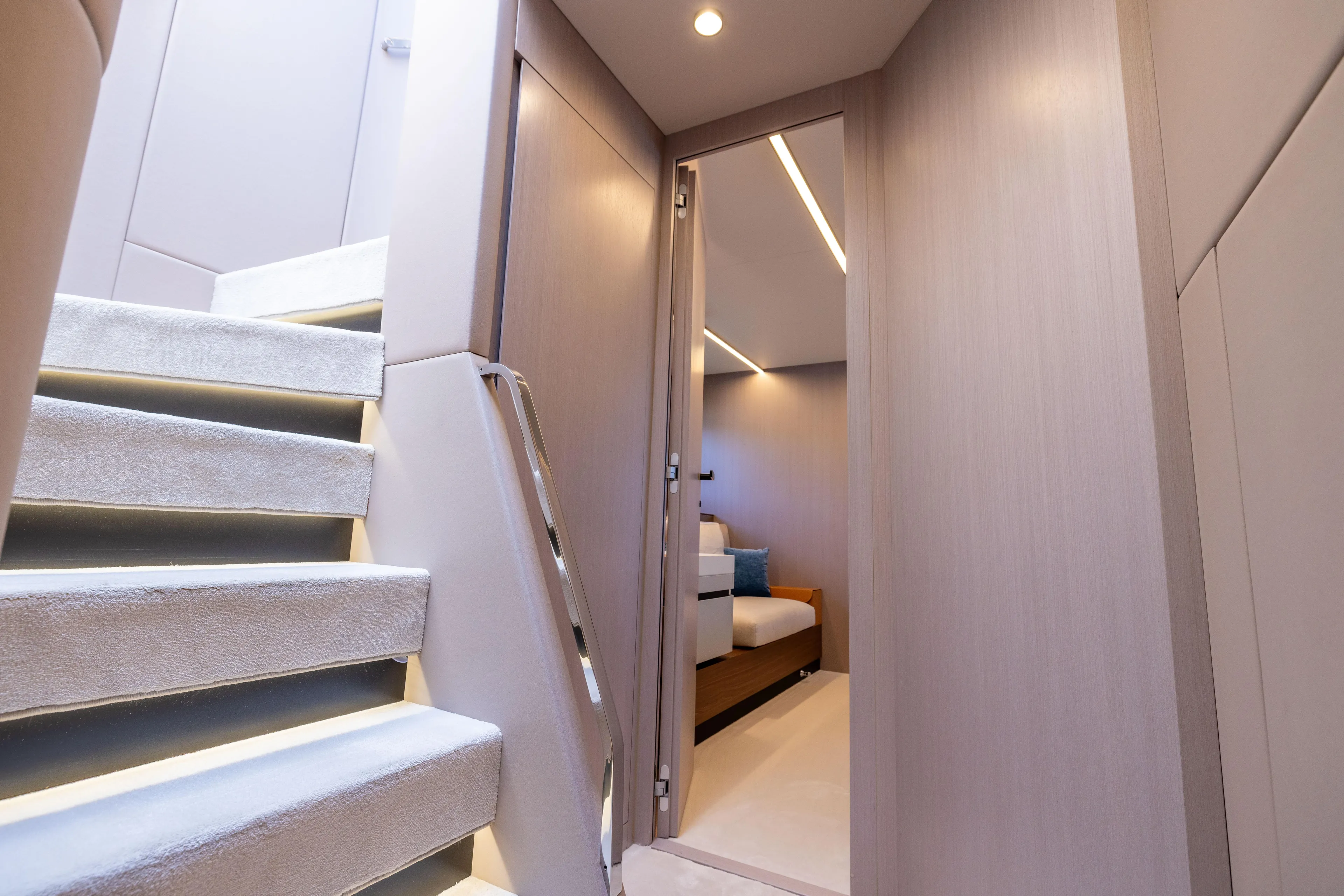 Second Chances Yacht Photos Pics Luxurious interior of 2024 Azimut S7 yacht, featuring modern staircase and cozy bedroom.